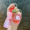 Nuevo llavero de biberón transfronterizo, exquisito colgante de arena líquida, accesorio de llavero para bolso, pequeño regalo, venta al por mayor de comercio exterior
