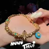 Pulseira Antiga de Ouro com Pedras Turquesa e Cravejada de Diamantes em Formato de Roda de Flor Vajra Envolvente para o Pulso Novo Estilo Chinês Sonho Bêbado Rio Estrelado Pulseira Estrela