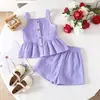 Conjunto de verano de ropa infantil de comercio exterior: Conjunto de dos piezas: top de tirantes dulce de color liso con volantes + shorts transpirables a juego
