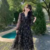 Vestido Longo Saia 2026 Primavera e Outono Novo Estilo Versátil Preto Floral Manga Longa Decote V Cintura Saia Longa