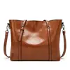2023 nuevo bolso de moda europeo y americano para mujer bolso tote de cuero encerado de moda bolso de hombro simple para mujer una generación de pelo