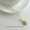 Pendientes de botón ovalados con incrustaciones de circonita bañados en oro estilo vintage, pendientes de perla con elegancia francesa, pendientes versátiles de lujo de alta gama