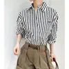 Camisa de algodón puro a rayas blancas y negras de alta gama para mujer, nueva colección de otoño 2026, polo de manga larga, estilo elegante y lujoso