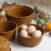 Venda por atacado de fábrica vaso de flor de palha trançada redondo vaso cesta organizador de mesa cesta de armazenamento de cosméticos