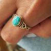 Cao Shi Anillo hueco retro europeo y americano de imitación turquesa Anillo de índice de diseño de nicho moderno blanco anillo con patrón