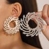 Pendientes de girasol con incrustaciones de cristal de aleación en espiral exagerada transfronteriza europea y americana, joyería femenina para la cena con temperamento al por mayor para mujer