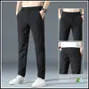 Pantalones casuales de verano para hombre, corte holgado, cintura elástica, pierna recta largos, pantalones de traje negros para primavera y otoño, estilo seda de hielo ultradelgada