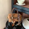 Bolsa Boston de mano estilo retro de comercio exterior para mujer, nuevo estilo, versión coreana, bolsa tipo almohada de nicho, bolsa diaria de un solo hombro cruzada, moderna