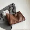 Bolsa de ombro feminina Shuai Mi Jia 2026 outono nova cor sólida grande capacidade bolsa tote, bolsa de trabalho estilosa e texturizada