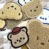 Toalha de cabeça de urso de desenho animado bordado adesivos de pano computador logotipo bordado em estoque atacado roupas sapatos e chapéus acessórios LOGOTIPO adesivos bordados