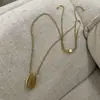 Doudou Mismo Estilo Oval Deslizante Vintage Nicho Estilo Francés Colgante de Piedra Collar Ins Alto Sentido Cadena Larga de Lana