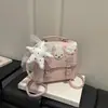 Mochila nueva, elegante y moderna, de estilo universitario nicho con diseño de estrellas, versátil como bolso de mano, bolso de hombro o cruzado de moda