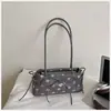 Bolso de axila de lunares estilo coreano, nicho súper popular para mujer, nuevo modelo otoño 2026, bolso de hombro exquisito y elegante, versátil para el trabajo