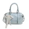 Corea del Sur Moda Tendencia Estilo Crema Simple Portátil Bolso Almohada de Cuero Suave Moda Femenina Versátil Casual para Viaje Bolso Cruzado