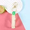 Llavero colgante de cuerda de cuero con letra de color transparente brillante, llavero de dibujos animados con accesorios flotantes de aceite, llavero colgante, pulsera al por mayor