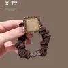 Novo elástico de cabelo com pedras de strass, estilo coreano e japonês, para mulheres, estiloso e moderno, alta elasticidade, adequado para rabos de cavalo e versátil para coques.