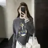 Estación Europea 2026 Otoño/Invierno Nuevo Estilo Coreano Cuello Redondo Suéter de Lana de Dibujos Animados para Mujer, Corte Holgado, Top de Punto que Reduce la Edad