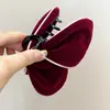 Pinza para el pelo de tiburón de moda de terciopelo con borde blanco, forma de mariposa negra flocada, Rojo de Año Nuevo 2025, Pasador de Otoño e Invierno para Mujer