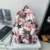 Mochila moderna con graffiti para hombre, adecuada para estudiantes de secundaria, preparatoria y universidad; Mochila de viaje elegante de gran capacidad para mujer