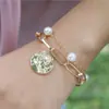 Europa y Estados Unidos pulsera de mano transfronteriza creativa retro simple estilo frío cadena doble de perlas venta directa de fábrica