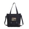Cross-border 2024 nova bolsa de maquiagem de grande capacidade para estudantes, bolsa de ombro com textura da moda, bolsa de compras, sacola