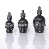 Atacado em estoque do fabricante de frascos de perfume de várias cores de 30ml em formato de caveira, frascos de cânhamo, pequenos frascos de óleo essencial e frascos decorativos de vidro