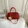 Bolsa Pequena Retro de Luxo para Mulheres 2026 Nova Super Popular Versátil Bolsa Transversal Elegante Bolsa de Ombro Bolsa de Mão Formato de Concha