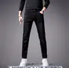 Pantalones vaqueros negros de alta gama para hombre, forrados de forro polar para otoño e invierno, estilo europeo, bordados, corte ajustado, pitillo, elásticos, versátiles, casuales, modernos