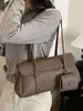 Bolso de axila de alta gama, nicho y sutilmente lujoso para mujer, con un nuevo diseño minimalista con patrón de lichi texturizado, estilo tote y correa para el hombro, perfecto para el día a día.