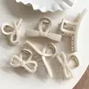 Elegante pasador estilo blanco arroz para mujer, pinza para el pelo de moño en la parte trasera de la cabeza, nuevo clip de tiburón 2025, pasador simple versátil, tocado