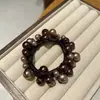 Nuevo anillo para el pelo de perlas versión coreana de cuerda para el pelo simple de alta gama de alta elasticidad anillo para el pelo al por mayor tamaño perla sentido de alta gama accesorios para el pelo
