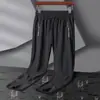 Pantalones deportivos de seda de hielo de verano de talla grande para hombre, pantalones casuales de secado rápido y alta elasticidad, pantalones rectos transpirables para exteriores con aire acondicionado.