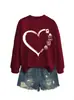 Sudadera casual simple divertida versátil de manga larga para mujer con diseños de corazón, gafas, lápiz y libro - En stock en Amazon