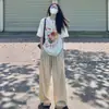 Camiseta Blanca de Algodón Puro de Manga Corta para Mujer 2026 Nueva Popular de Verano Estilo Americano Diseño de Hombro Caído Top de Media Manga
