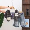 Conjunto de Primavera y Otoño para Niños 2026 Nuevo Estilo Bebé Cuadros con Capucha Manga Larga Conjunto de Tres Piezas Elegante Ropa de Otoño para Niños
