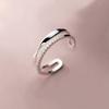 Anillo femenino japonés y coreano net red temperamento viento frío línea retorcida doble hueco diamante circón abierto anillo de comida al por mayor