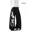 Jeans americano retrô de corte curvo desconstruído, estilo outono e inverno, design de alta costura, caimento solto, modelagem que afina a silhueta, calça pantalona ampla com caimento fluido
