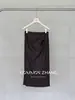 Saia de couro PU retrô americana Youji CZZHANG feminina outono novo produto fenda bodycon meia saia C32626