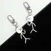 Llavero con colgante de pareja de grafiti de acero inoxidable exclusivo transfronterizo, figura pequeña, llavero de hombre palo grande