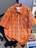 Camisa de rayas arrugadas de lujo ligero estilo coreano para hombre, camisa texturizada de manga corta holgada, camisa para ir al trabajo, naranja