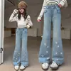 Calça Flare Jeans Nova Primavera 2026 Novo Estilo para Crianças Médias e Grandes Cintura Alta Solta Estilosa Tendência Flare Micro Calça Longa