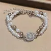 Pulsera de perlas nicho alto sentido temperamento dulce chica personalidad pulsera mayoreo 2024 nueva joyería red
