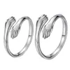 Anillo de pareja de moda trendy de dos manos abrazándose abierto red social anillo de pareja de dos manos abrazándose Anillo Anillo