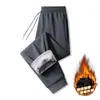 Pantalones de algodón para hombre transfronterizos para uso en exteriores, pantalones casuales juveniles con forro polar, pantalones a prueba de viento y cálidos, pantalones rectos de invierno, pantalones deportivos para estudiantes