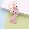 Llavero de Dinosaurio de Dibujos Animados Colgante para Bolso de Piel PU Llavero de Campana de Cuero Personalizado Llavero de Coche Colgantes de Regalo