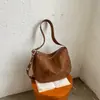 Bolso de mano retro de gamuza para otoño e invierno para mujer, nuevo bolso estilo dumpling 2026 elegante y versátil, bolso cruzado casual para el día a día