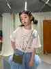 Roupa Infantil Floral e Fofa Camiseta para Meninas 2026 Verão Nova Estilo Coreano Laço Manga Curta Doce Versátil Estilo Menina