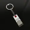 Llavero colgante de aleación de metal con diseño de mariposa Zhilang You Bean de Anime Ghost Extermination Blade que rodea el carbón. Comercio exterior.