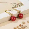 Pendientes de arena de emperador de alto contenido nicho alta calidad S925 plata de ley chapado en oro Pendientes de loto cuenta redonda de cinabrio gancho de oreja