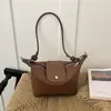 Comercio exterior transfronterizo, tejido minimalista para mujer, nueva colección otoño 2026, bolso de hombro estilo coreano para el día a día, bolso de hombro exquisito con forma de empanadilla